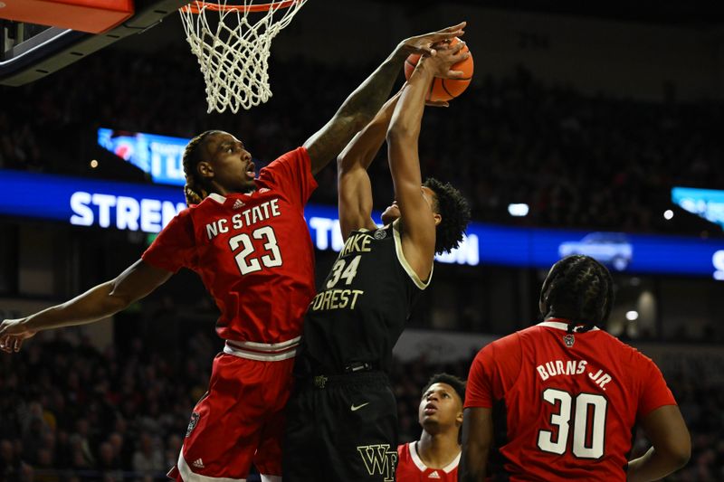 Jan 28, 2023; Winston-Salem, North Carolina, USA;   North Carolina State Wolfpack forward Greg Gantt (23) blocks the shot from Wake Forest Demon Deacons forward Bobi Klintman (34) during the first half at Lawrence Joel Veterans Memorial Coliseum. Mandatory Credit: William Howard-USA TODAY Sports