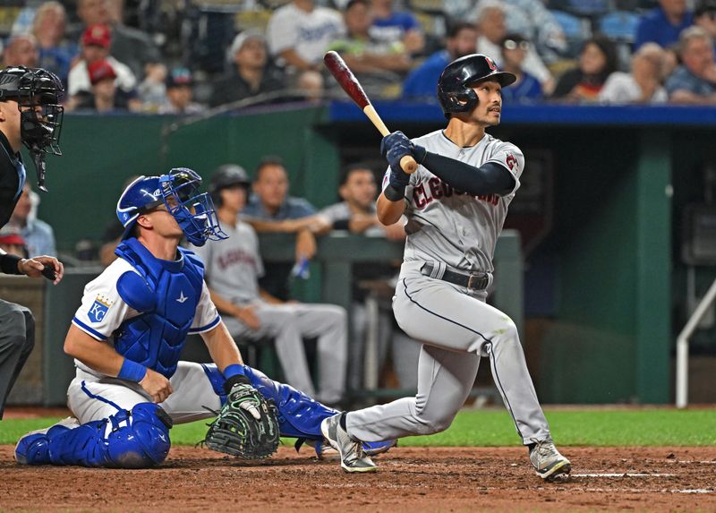 Sep 19, 2023; Kansas City, Missouri, USA; Cleveland Guardians left fielder Steven Kwan (38) hits a RBI triple in the sixth inning against the Kansas City Royals at Kauffman Stadium. Mandatory Credit: Peter Aiken-USA TODAY Sports