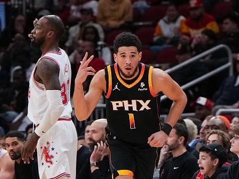 HOUSTON, TEXAS - DECEMBER 27: Devin Booker #1 of the Phoenix Suns reacts after sinking a three point shot in the third quarter of the game against the Houston Rockets at Toyota Center on December 27, 2023 in Houston, Texas. User expressly acknowledges and agrees that, by downloading and or using this photograph, User is consenting to the terms and conditions of the Getty Images License Agreement. (Photo by Alex Bierens de Haan/Getty Images)