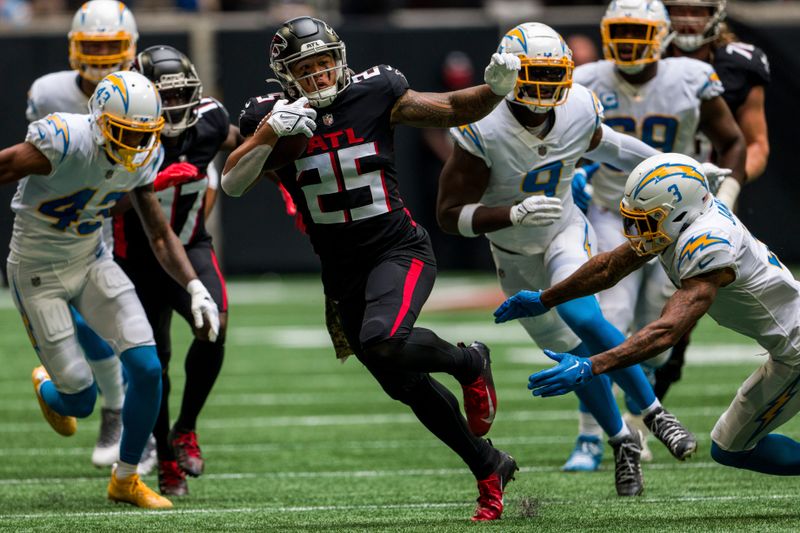 Atlanta Falcons running back Tyler Allgeier (25) runs the ball during the first half of an NFL football game against the Los Angeles Chargers, Sunday, Nov. 6, 2022, in Atlanta. (AP Photo/Danny Karnik)