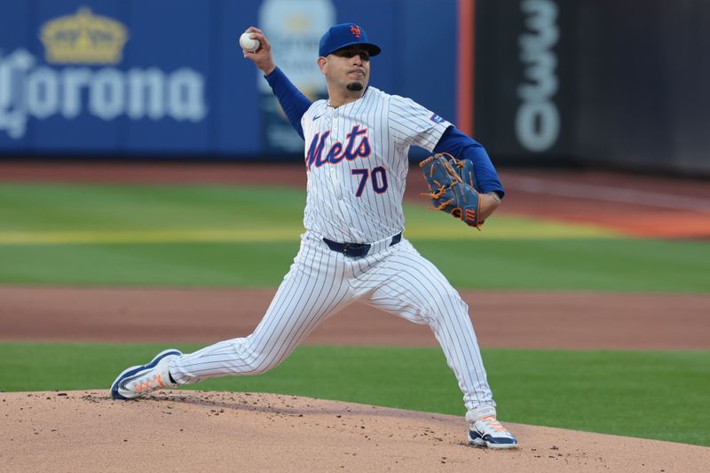 Apr 26, 2024; New York City, New York, USA; New York Mets starting pitcher Jose Butto (70) delivers a pitch during the first inning against the St. Louis Cardinals at Citi Field. Mandatory Credit: Vincent Carchietta-USA TODAY Sports