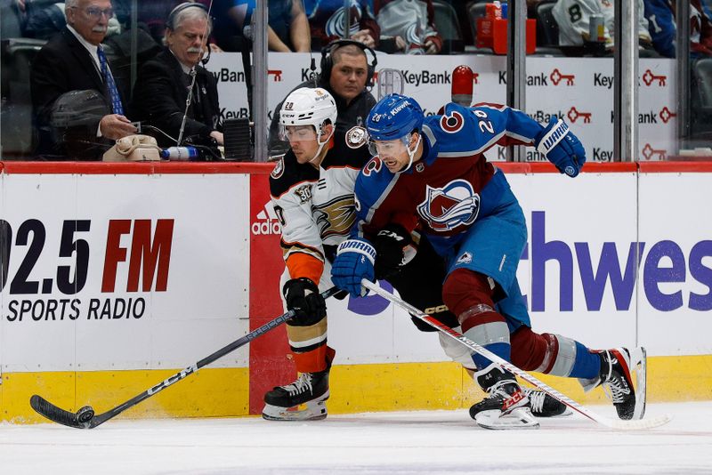 Dec 5, 2023; Denver, Colorado, USA; Anaheim Ducks right wing Brett Leason (20) and Colorado Avalanche left wing Miles Wood (28) battle for the puck in the first period at Ball Arena. Mandatory Credit: Isaiah J. Downing-USA TODAY Sports