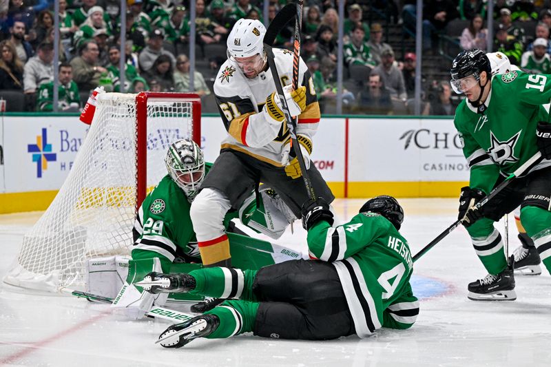 Dec 9, 2023; Dallas, Texas, USA; Vegas Golden Knights right wing Mark Stone (61) and Dallas Stars goaltender Jake Oettinger (29) and defenseman Miro Heiskanen (4) battle for control of the loose puck in the Stars zone during the third period at the American Airlines Center. Mandatory Credit: Jerome Miron-USA TODAY Sports