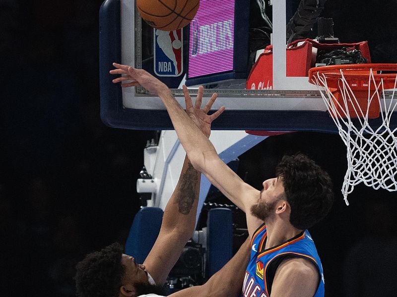 OKLAHOMA CITY, OKLAHOMA - JANUARY 29: Chet Holmgren #7 of the Oklahoma City Thunder blocks the shot of Karl-Anthony Towns #32 of the Minnesota Timberwolves during the first half at Paycom Center on January 29, 2024 in Oklahoma City, Oklahoma. NOTE TO USER: User expressly acknowledges and agrees that, by downloading and or using this Photograph, user is consenting to the terms and conditions of the Getty Images License Agreement. (Photo by Joshua Gateley/Getty Images)