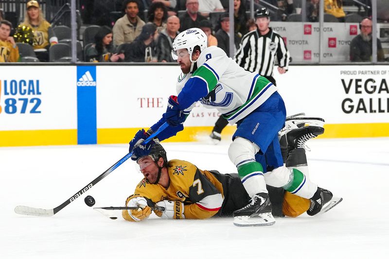 Mar 7, 2024; Las Vegas, Nevada, USA; Vegas Golden Knights defenseman Alex Pietrangelo (7) sweeps the puck away from Vancouver Canucks right wing Conor Garland (8) during the third period at T-Mobile Arena. Mandatory Credit: Stephen R. Sylvanie-USA TODAY Sports