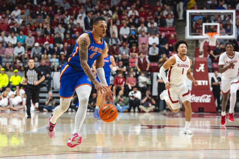 Mar 5, 2025; Tuscaloosa, Alabama, USA; Florida Gators guard Will Richard (5) drives the ball against the Alabama Crimson Tide during the first half at Coleman Coliseum. Mandatory Credit: Will McLelland-Imagn Images