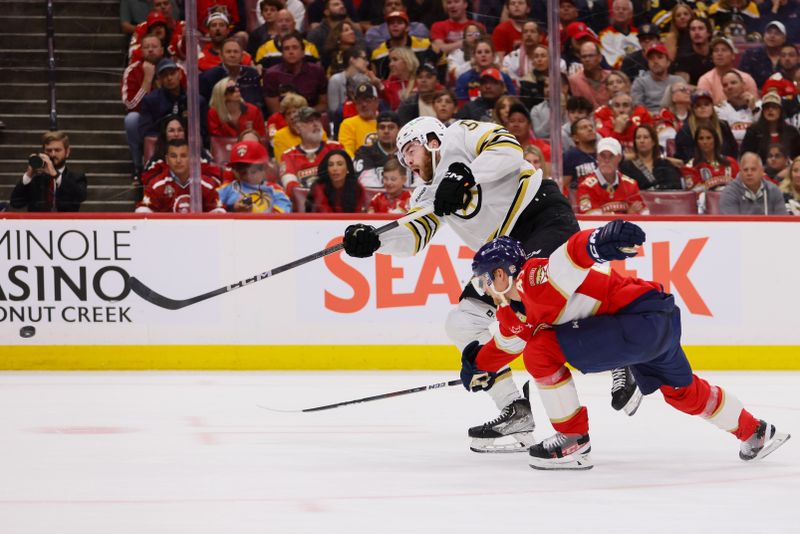 May 14, 2024; Sunrise, Florida, USA; Boston Bruins right wing Justin Brazeau (55) shoots the puck as Florida Panthers defenseman Gustav Forsling (42) defends during the third period in game five of the second round of the 2024 Stanley Cup Playoffs at Amerant Bank Arena. Mandatory Credit: Sam Navarro-USA TODAY Sports