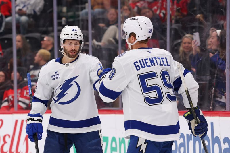 Dec 11, 2025; Newark, New Jersey, USA; Tampa Bay Lightning right wing Oliver Bjorkstrand (22) celebrates his goal against the New Jersey Devils during the third period at Prudential Center. Mandatory Credit: Ed Mulholland-Imagn Images