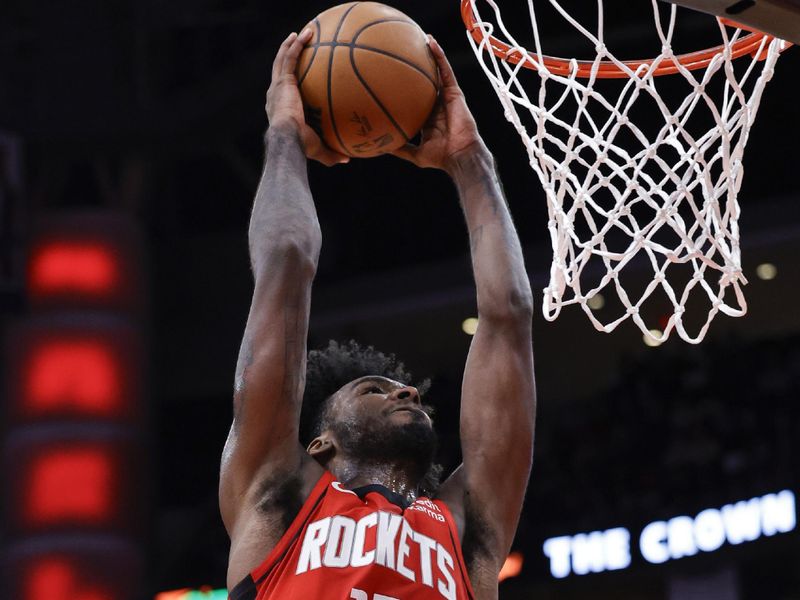 HOUSTON, TEXAS - DECEMBER 11: Tari Eason #17 of the Houston Rockets dunks the ball against the San Antonio Spurs during the second half at Toyota Center on December 11, 2023 in Houston, Texas. NOTE TO USER: User expressly acknowledges and agrees that, by downloading and or using this photograph, User is consenting to the terms and conditions of the Getty Images License Agreement.? (Photo by Carmen Mandato/Getty Images)