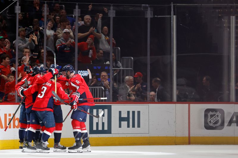 Feb 11, 2024; Washington, District of Columbia, USA; Washington Capitals left wing Alex Ovechkin (8) celebrates with teammates after scoring a goal against the Vancouver Canucks in the second period at Capital One Arena. Mandatory Credit: Geoff Burke-USA TODAY Sports