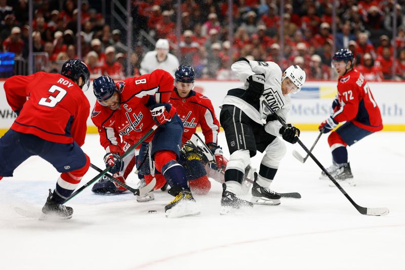 Nov 17, 2025; Washington, District of Columbia, USA; Washington Capitals left wing Alex Ovechkin (8) and Los Angeles Kings left wing Trevor Moore (12) battle for the puck in front of Capitals goaltender Charlie Lindgren (79) at Capital One Arena. Mandatory Credit: Geoff Burke-Imagn Images