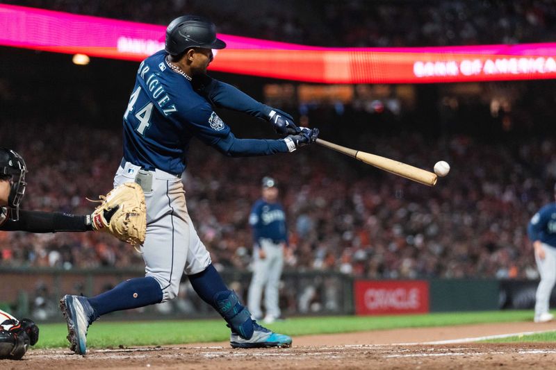 Jul 3, 2023; San Francisco, California, USA;  Seattle Mariners center fielder Julio Rodriguez (44) hits a two RBI double during the ninth inning against the San Francisco Giants at Oracle Park. Mandatory Credit: Stan Szeto-USA TODAY Sports