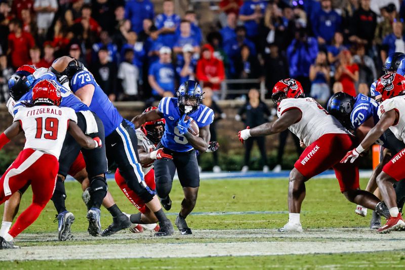 Oct 14, 2023; Durham, North Carolina, USA; Duke Blue Devils wide receiver Jordan Moore (8) runs with the ball during the second half of the game against North Carolina State Wolfpack at Wallace Wade Stadium. Mandatory Credit: Jaylynn Nash-USA TODAY Sports