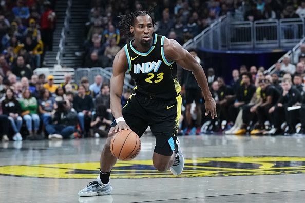 INDIANAPOLIS, INDIANA - DECEMBER 20: Aaron Nesmith #23 of the Indiana Pacers dribbles the ball in the second quarter against the Charlotte Hornets at Gainbridge Fieldhouse on December 20, 2023 in Indianapolis, Indiana. NOTE TO USER: User expressly acknowledges and agrees that, by downloading and or using this photograph, User is consenting to the terms and conditions of the Getty Images License Agreement. (Photo by Dylan Buell/Getty Images)