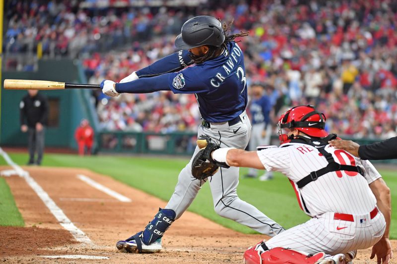 Apr 25, 2023; Philadelphia, Pennsylvania, USA; Seattle Mariners shortstop J.P. Crawford (3) hits an RBI single against the Philadelphia Phillies during the fifth inning at Citizens Bank Park. Mandatory Credit: Eric Hartline-USA TODAY Sports