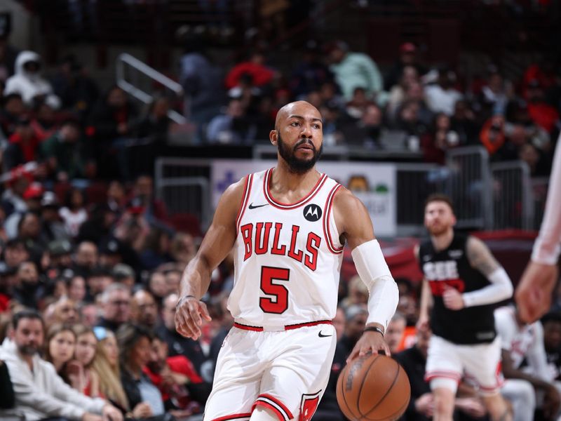 CHICAGO, IL - MARCH 18:  Jevon Carter #5 of the Chicago Bulls handles the ball during the game against the Portland Trail Blazers on March 18, 2024 at United Center in Chicago, Illinois. NOTE TO USER: User expressly acknowledges and agrees that, by downloading and or using this photograph, User is consenting to the terms and conditions of the Getty Images License Agreement. Mandatory Copyright Notice: Copyright 2024 NBAE (Photo by Jeff Haynes/NBAE via Getty Images)