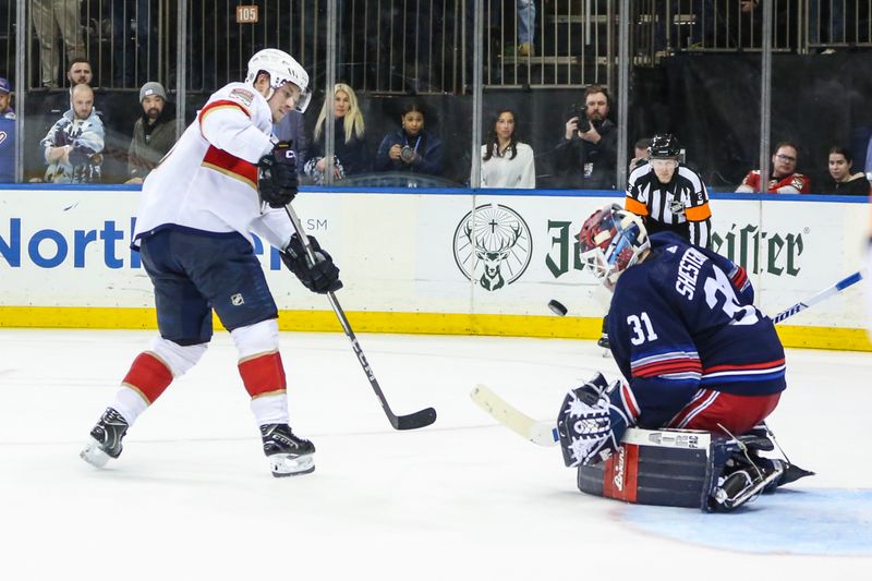 Mar 23, 2024; New York, New York, USA; New York Rangers goaltender Igor Shesterkin (31) makes a save on a shot on goal attempt by Florida Panthers right wing Vladimir Tarasenko (10) during a shootout in overtime at Madison Square Garden. Mandatory Credit: Wendell Cruz-USA TODAY Sports