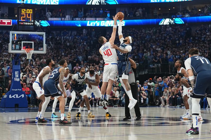 DALLAS, TX - APRIL 26: The opening tip off during the game between the LA Clippers and the Dallas Mavericks during Round 1 Game 3 of the 2024 NBA Playoffs on April 26, 2024 at the American Airlines Center in Dallas, Texas. NOTE TO USER: User expressly acknowledges and agrees that, by downloading and or using this photograph, User is consenting to the terms and conditions of the Getty Images License Agreement. Mandatory Copyright Notice: Copyright 2023 NBAE (Photo by Glenn James/NBAE via Getty Images)