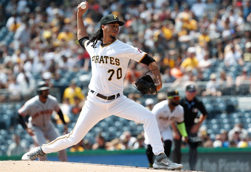 Jul 16, 2023; Pittsburgh, Pennsylvania, USA; Pittsburgh Pirates starting pitcher Osvaldo Bido (70) delivers a pitch against the San Francisco Giants during the first inning at PNC Park. Mandatory Credit: Charles LeClaire-USA TODAY Sports