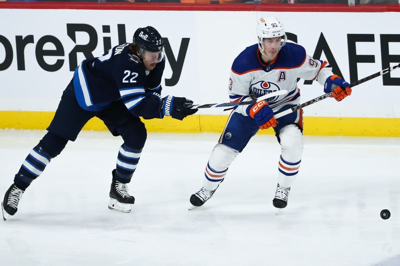 Nov 30, 2023; Winnipeg, Manitoba, CAN; Edmonton Oilers forward Ryan Nugent-Hopkins (93) skates away from Winnipeg Jets forward Mason Appleton (22) during the third period at Canada Life Centre. Mandatory Credit: Terrence Lee-USA TODAY Sports