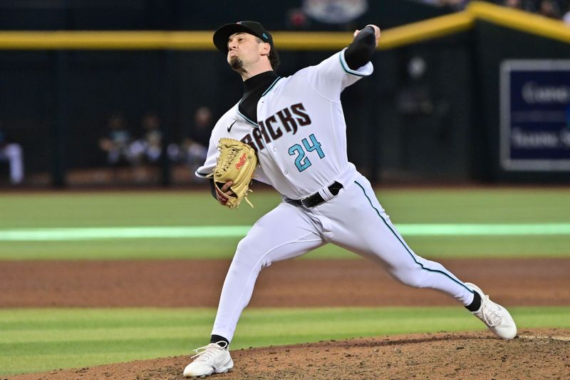 Sep 20, 2023; Phoenix, Arizona, USA;  Arizona Diamondbacks relief pitcher Kyle Nelson (24) throws in the ninth inning against the San Francisco Giants at Chase Field. Mandatory Credit: Matt Kartozian-USA TODAY Sports