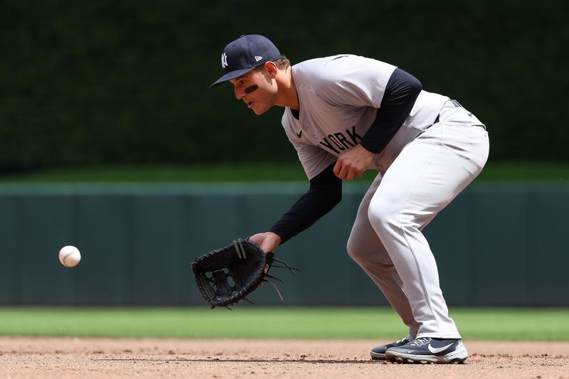 May 16, 2024; Minneapolis, Minnesota, USA; New York Yankees first baseman Anthony Rizzo (48) fields the ball hit by Minnesota Twins Manuel Margot (13) during the fifth inning at Target Field. Mandatory Credit: Matt Krohn-USA TODAY Sports