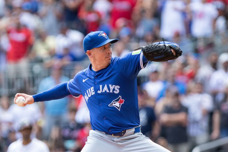 Sep 8, 2024; Cumberland, Georgia, USA; Toronto Blue Jays pitcher Chad Green (57) pitches the ball against the Atlanta Braves during the tenth inning at Truist Park. Mandatory Credit: Jordan Godfree-Imagn Images