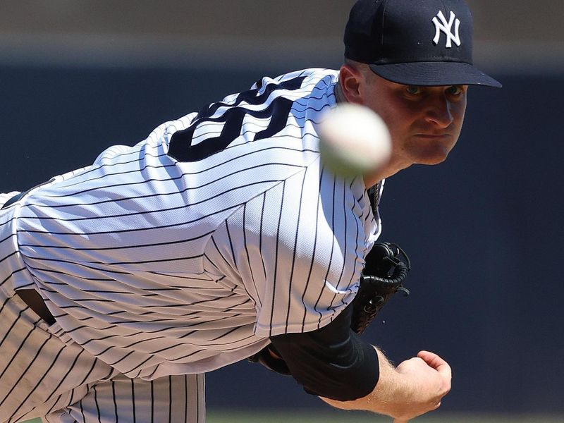 Feb 26, 2023; Tampa, Florida, USA; New York Yankees starting pitcher Clarke Schmidt (86) throws a pitch during the first inning against the Atlanta Braves at George M. Steinbrenner Field. Mandatory Credit: Kim Klement-USA TODAY Sports