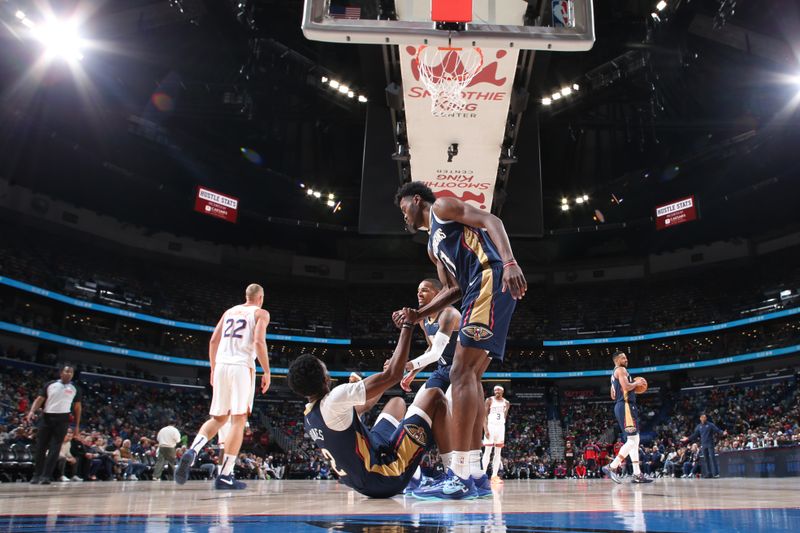 NEW ORLEANS, LA - DECEMBER 5: Herbert Jones #2 of the New Orleans Pelicans gets helped off floor by teammates during the game against the Phoenix Suns on December 5, 2024 at the Smoothie King Center in New Orleans, Louisiana. NOTE TO USER: User expressly acknowledges and agrees that, by downloading and or using this Photograph, user is consenting to the terms and conditions of the Getty Images License Agreement. Mandatory Copyright Notice: Copyright 2024 NBAE (Photo by Layne Murdoch Jr./NBAE via Getty Images)