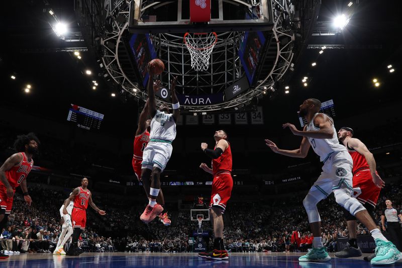 MINNEAPOLIS, MN -  MARCH 31: Anthony Edwards #5 of the Minnesota Timberwolves drives to the basket during the game against the Chicago Bulls on March 31, 2024 at Target Center in Minneapolis, Minnesota. NOTE TO USER: User expressly acknowledges and agrees that, by downloading and or using this Photograph, user is consenting to the terms and conditions of the Getty Images License Agreement. Mandatory Copyright Notice: Copyright 2024 NBAE (Photo by Jordan Johnson/NBAE via Getty Images)