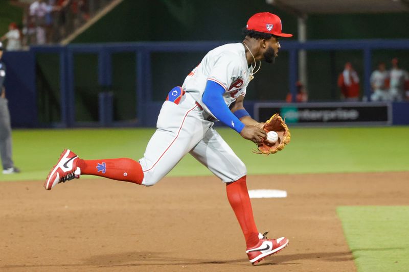 Mar 15, 2024; West Palm Beach, Florida, USA; Philadelphia Phillies shortstop Rodolfo Castro (29) fields a high hopper during the sixth inning against the Houston Astros at The Ballpark of the Palm Beaches. Mandatory Credit: Reinhold Matay-USA TODAY Sports