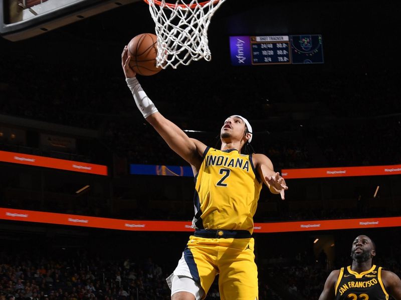 SAN FRANCISCO, CA - MARCH 22: Andrew Nembhard #2 of the Indiana Pacers drives to the basket during the game against the Golden State Warriors on March 22, 2024 at Chase Center in San Francisco, California. NOTE TO USER: User expressly acknowledges and agrees that, by downloading and or using this photograph, user is consenting to the terms and conditions of Getty Images License Agreement. Mandatory Copyright Notice: Copyright 2024 NBAE (Photo by Noah Graham/NBAE via Getty Images)