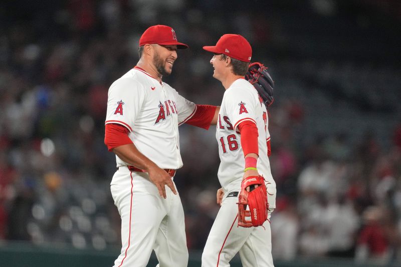 Jul 10, 2024; Anaheim, California, USA; Los Angeles Angels relief pitcher Carlos Estevez (53) celebrates with center fielder Mickey Moniak (16)] after a game against the Texas Rangers at Angel Stadium. Mandatory Credit: Kirby Lee-USA TODAY Sports