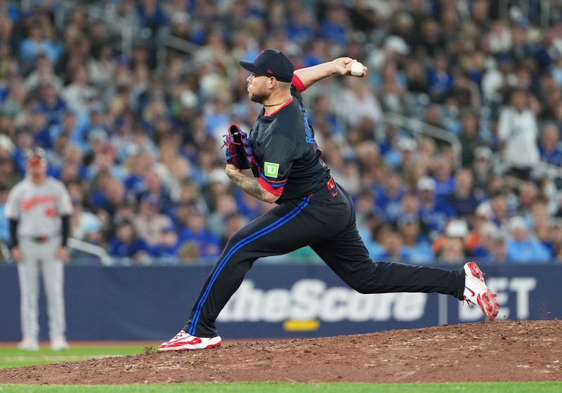 Sep 12, 2025; Toronto, Ontario, CAN; Toronto Blue Jays pitcher Yariel Rodríguez (29) throws a pitch against the Baltimore Orioles during the ninth inning at Rogers Centre. Mandatory Credit: Nick Turchiaro-Imagn Images