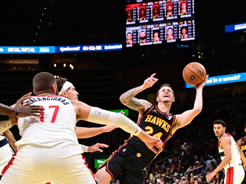 ATLANTA, GA - NOVEMBER 15:  Garrison Mathews #24 of the Atlanta Hawks shoots the ball during the game against the Washington Wizards during the Emirates NBA Cup game on November 15, 2024 at State Farm Arena in Atlanta, Georgia.  NOTE TO USER: User expressly acknowledges and agrees that, by downloading and/or using this Photograph, user is consenting to the terms and conditions of the Getty Images License Agreement. Mandatory Copyright Notice: Copyright 2024 NBAE (Photo by Adam Hagy/NBAE via Getty Images)