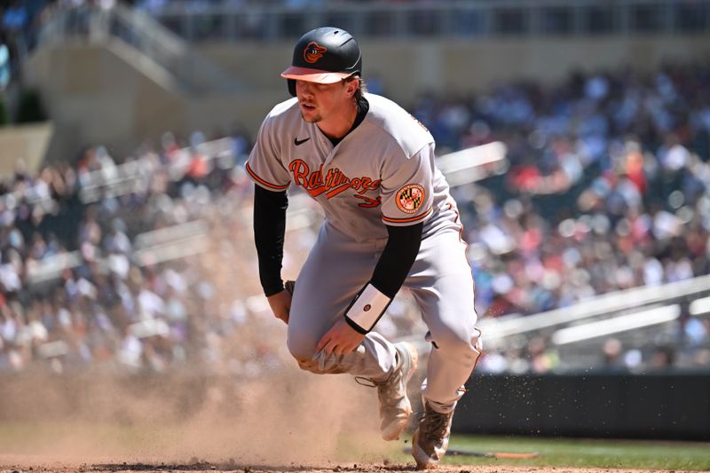 Jul 9, 2023; Minneapolis, Minnesota, USA; Baltimore Orioles catcher Adley Rutschman (35) scores on a RBI single by first baseman Ryan Mountcastle (not pictured) against the Minnesota Twins during the fifth inning at Target Field. Mandatory Credit: Jeffrey Becker-USA TODAY Sports 