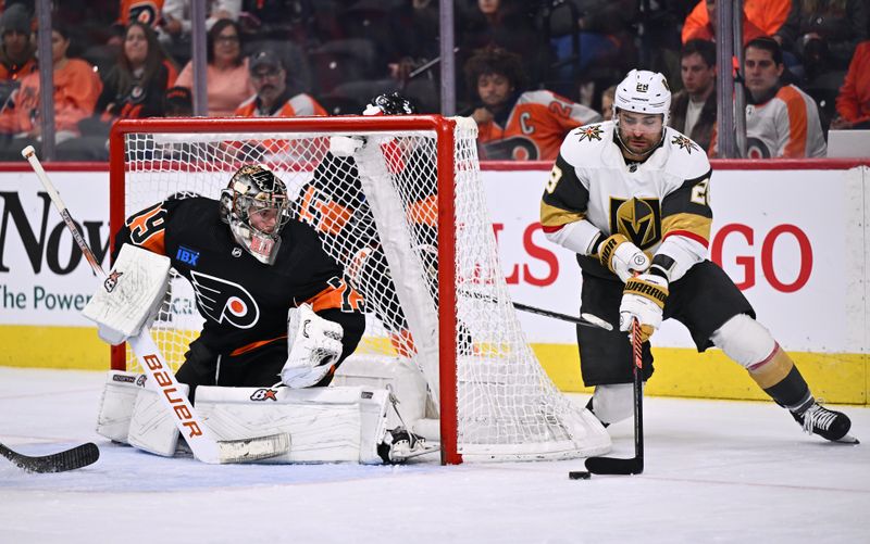 Nov 18, 2023; Philadelphia, Pennsylvania, USA; Vegas Golden Knights left wing William Carrier (28) wraps the puck around the net against Philadelphia Flyers goalie Carter Hart (79) in the third period at Wells Fargo Center. Mandatory Credit: Kyle Ross-USA TODAY Sports