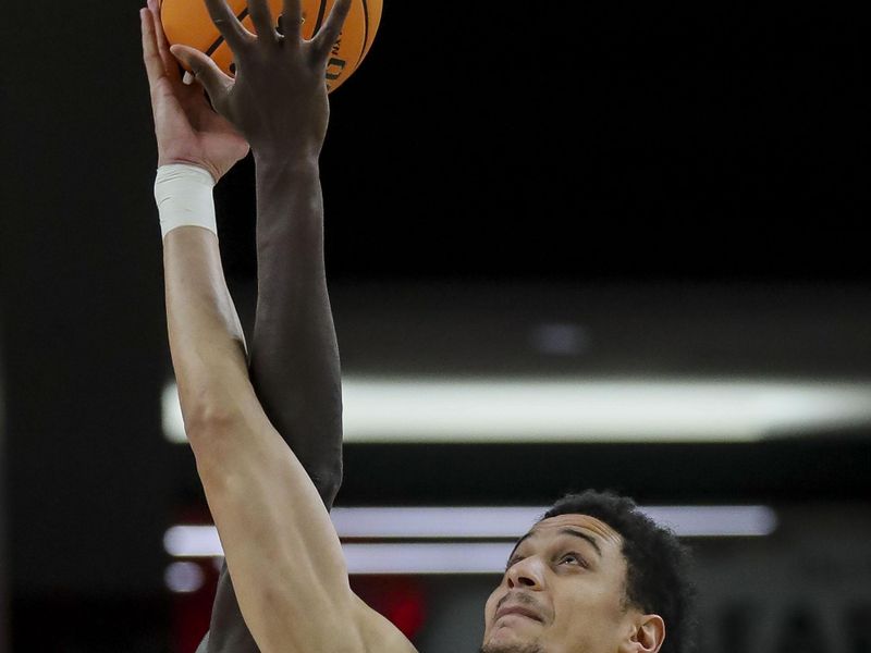 Mar 9, 2024; Cincinnati, Ohio, USA; West Virginia Mountaineers center Jesse Edwards (7) tips off against Cincinnati Bearcats forward Aziz Bandaogo (55) in the first half at Fifth Third Arena. Mandatory Credit: Katie Stratman-USA TODAY Sports