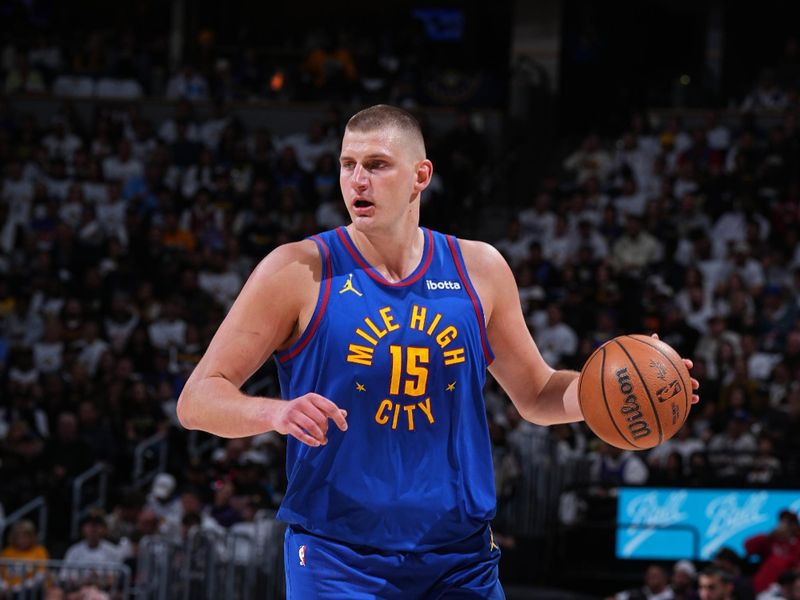 DENVER, CO - APRIL 20: Nikola Jokic #15 of the Denver Nuggets dribbles the ball during the game against the Los Angeles Lakers during Round 1 Game 1 of the 2024 NBA Playoffs on April 20, 2024 at the Ball Arena in Denver, Colorado. NOTE TO USER: User expressly acknowledges and agrees that, by downloading and/or using this Photograph, user is consenting to the terms and conditions of the Getty Images License Agreement. Mandatory Copyright Notice: Copyright 2024 NBAE (Photo by Garrett Ellwood/NBAE via Getty Images)