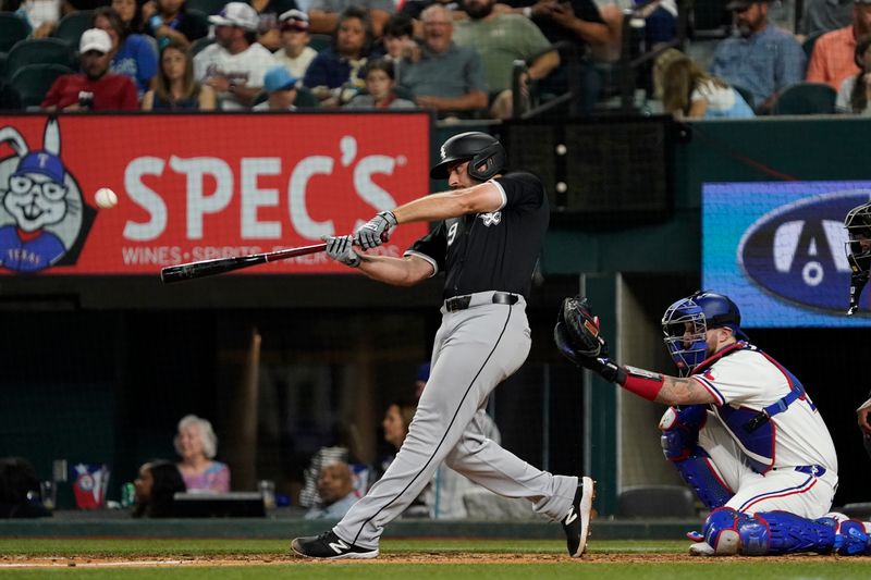 Jul 22, 2024; Arlington, Texas, USA; Chicago White Sox shortstop Paul DeJong (29) hits a solo home run during the ninth inning against the Texas Rangers at Globe Life Field. Mandatory Credit: Raymond Carlin III-USA TODAY Sports