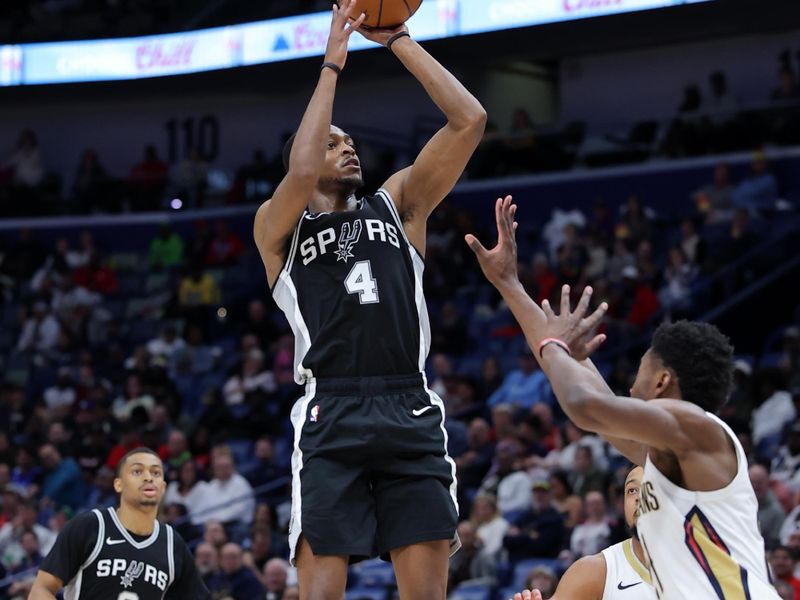 NEW ORLEANS, LOUISIANA - FEBRUARY 25: De'Aaron Fox #4 of the San Antonio Spurs shoots against Yves Missi #21 of the New Orleans Pelicans during the second half at Smoothie King Center on February 25, 2025 in New Orleans, Louisiana. NOTE TO USER: User expressly acknowledges and agrees that, by downloading and or using this Photograph, user is consenting to the terms and conditions of the Getty Images License Agreement. (Photo by Jonathan Bachman/Getty Images)