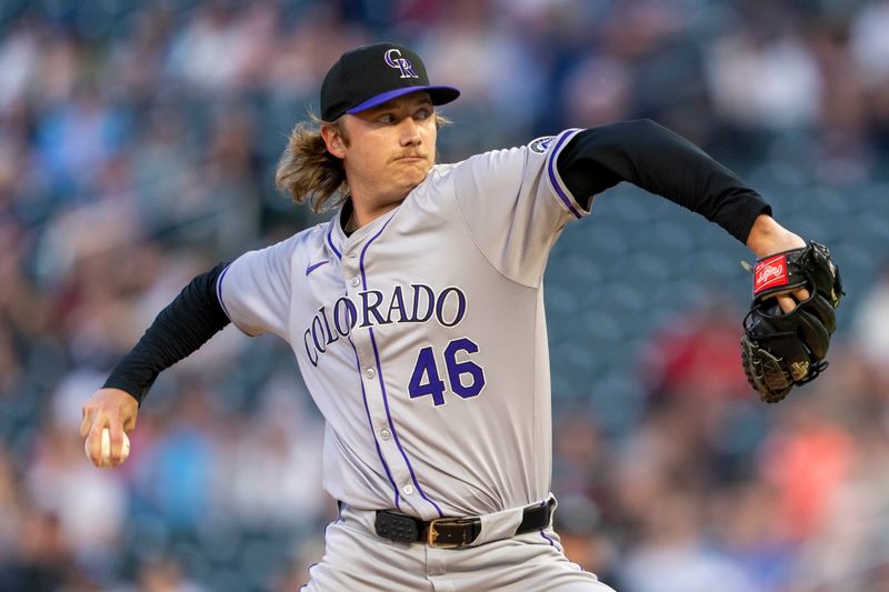 Jun 10, 2024; Minneapolis, Minnesota, USA; Colorado Rockies pitcher Nick Mears (46) delivers a pitch against the Minnesota Twins in the eighth inning at Target Field. Mandatory Credit: Jesse Johnson-USA TODAY Sports