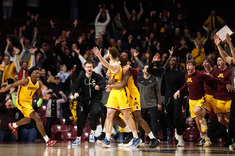 Mar 2, 2023; Minneapolis, Minnesota, USA; Minnesota Golden Gophers forward Jamison Battle is mobbed by teammates after his game-winning shot against the Rutgers Scarlet Knights during the second half at Williams Arena. Mandatory Credit: Matt Krohn-USA TODAY Sports