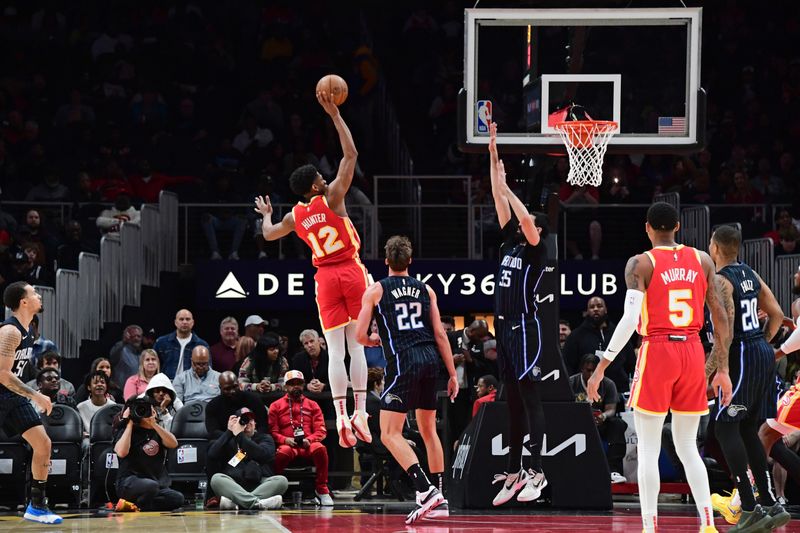 ATLANTA, GA - FEBRUARY 25: De'Andre Hunter #12 of the Atlanta Hawks shoots the ball during the game against the Orlando Magic on February 25, 2024 at State Farm Arena in Atlanta, Georgia.  NOTE TO USER: User expressly acknowledges and agrees that, by downloading and/or using this Photograph, user is consenting to the terms and conditions of the Getty Images License Agreement. Mandatory Copyright Notice: Copyright 2024 NBAE (Photo by Scott Cunningham/NBAE via Getty Images)