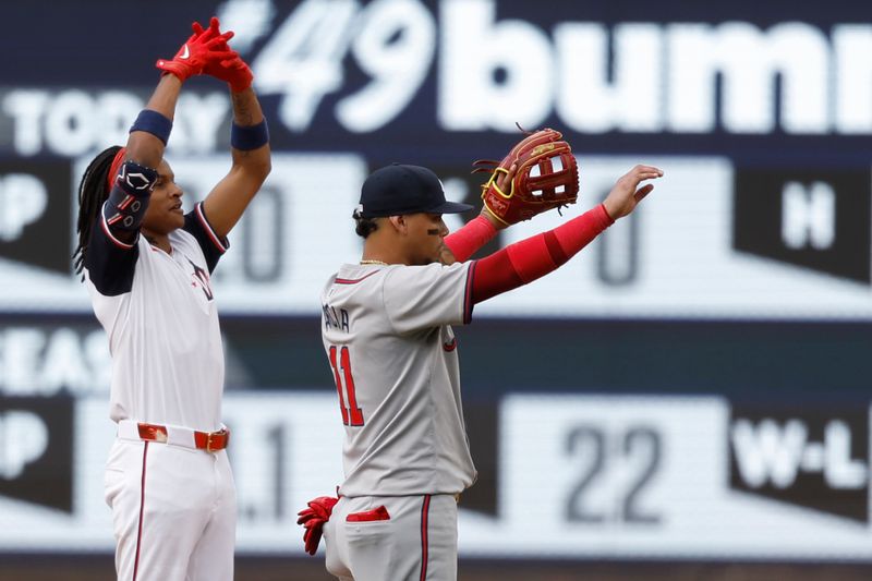 Jun 9, 2024; Washington, District of Columbia, USA; Washington Nationals shortstop CJ Abrams (5) gestures to his dugout after hitting a three run double as Atlanta Braves shortstop Orlando Arcia (11) gestures during the fourth inning at Nationals Park. Mandatory Credit: Geoff Burke-USA TODAY Sports