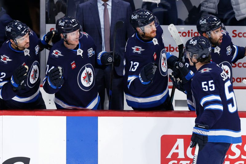 Oct 11, 2025; Winnipeg, Manitoba, CAN; Winnipeg Jets center Mark Scheifele (55) celebrates his goal against the Los Angeles Kings in the second period at Canada Life Centre. Mandatory Credit: James Carey Lauder-Imagn Images