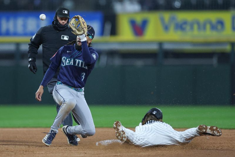 May 20, 2025; Chicago, Illinois, USA; Chicago White Sox shortstop Chase Meidroth (10) steals second base as Seattle Mariners shortstop J.P. Crawford (3) waits for the ball during the third inning at Rate Field. Mandatory Credit: Kamil Krzaczynski-Imagn Images