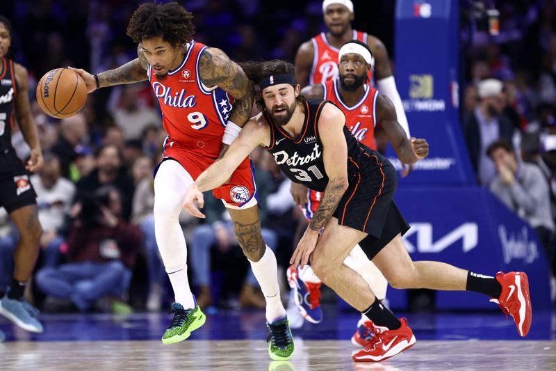 PHILADELPHIA, PENNSYLVANIA - DECEMBER 15: Kelly Oubre Jr. #9 of the Philadelphia 76ers steals the ball from Joe Harris #31 of the Detroit Pistons during the third quarter at the Wells Fargo Center on December 15, 2023 in Philadelphia, Pennsylvania. NOTE TO USER: User expressly acknowledges and agrees that, by downloading and or using this photograph, User is consenting to the terms and conditions of the Getty Images License Agreement. (Photo by Tim Nwachukwu/Getty Images)