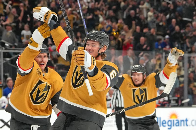 Nov 13, 2025; Las Vegas, Nevada, USA; Vegas Golden Knights defenseman Kaedan Korczak (6) celebrates with defenseman Jeremy Lauzon (5) after center Tomas Hertl (48) scored a goal against the New York Islanders during the third period at T-Mobile Arena. Mandatory Credit: Stephen R. Sylvanie-Imagn Images