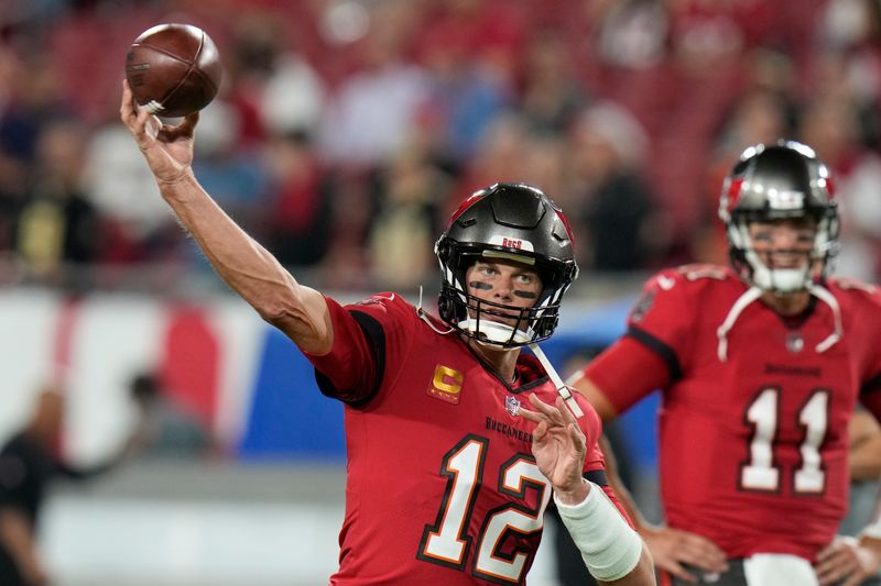 Tampa Bay Buccaneers quarterback Tom Brady (12) warms up before an NFL football game against the New Orleans Saints in Tampa, Fla., Monday, Dec. 5, 2022. (AP Photo/Chris O'Meara)